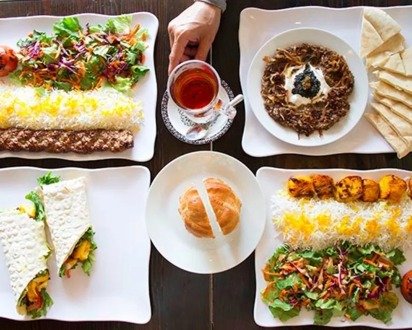 Persian kebab platter with rice and fresh herbs