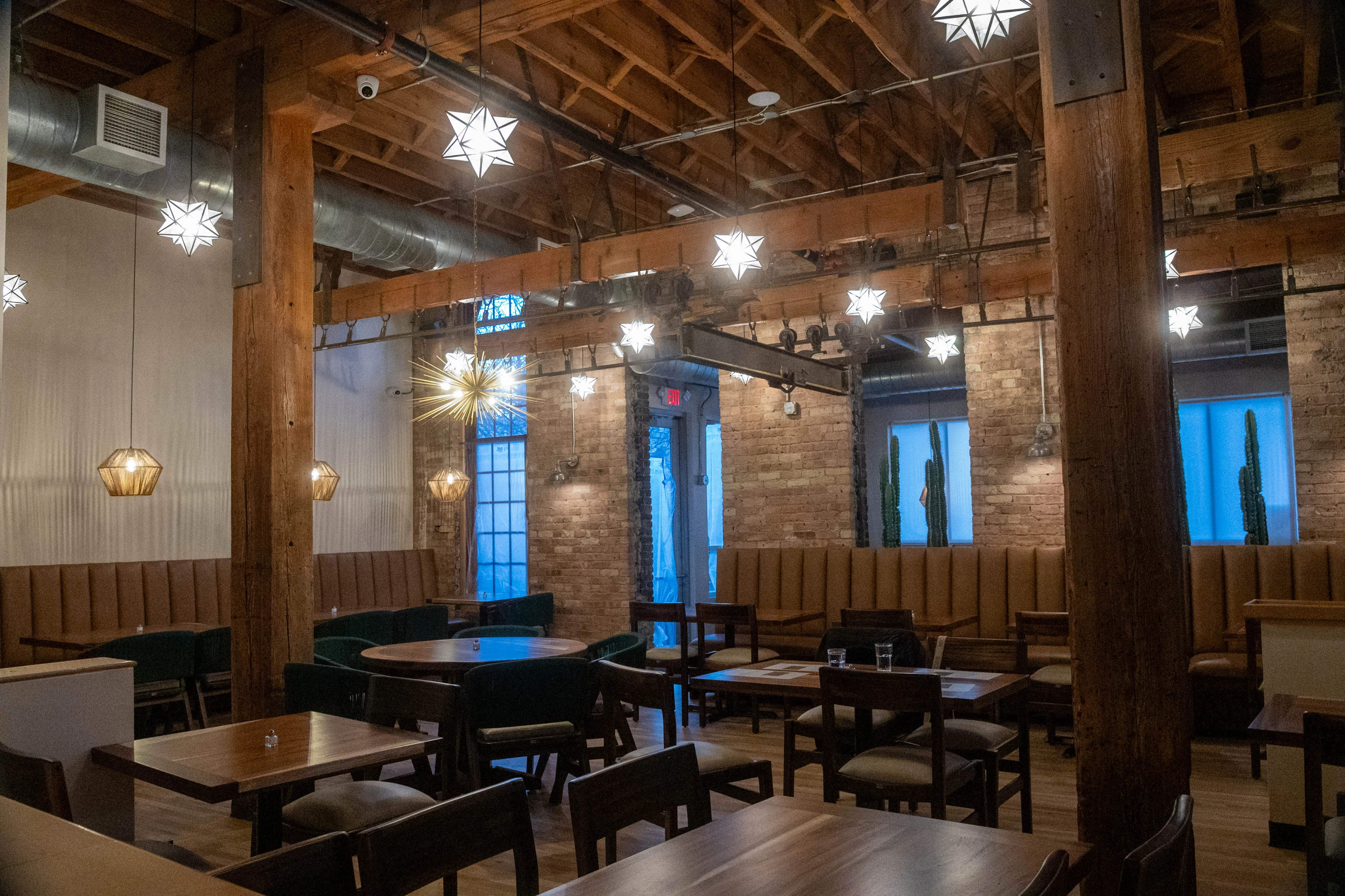 Cozy restaurant interior with warm lighting and rustic decor