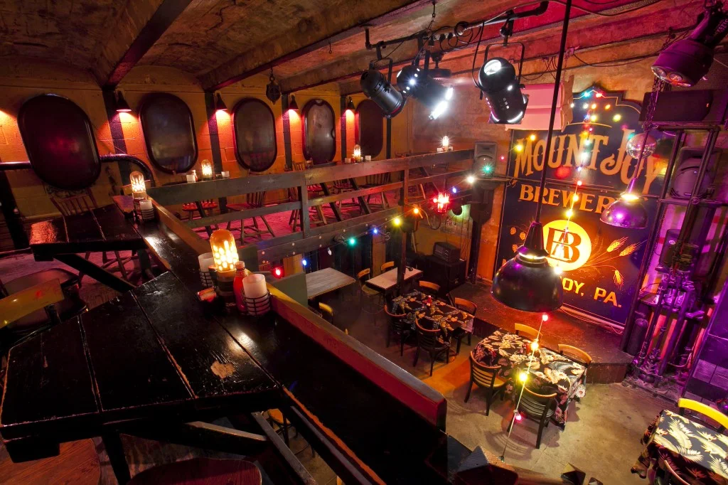 Cozy restaurant interior with vibrant lighting and rustic decor