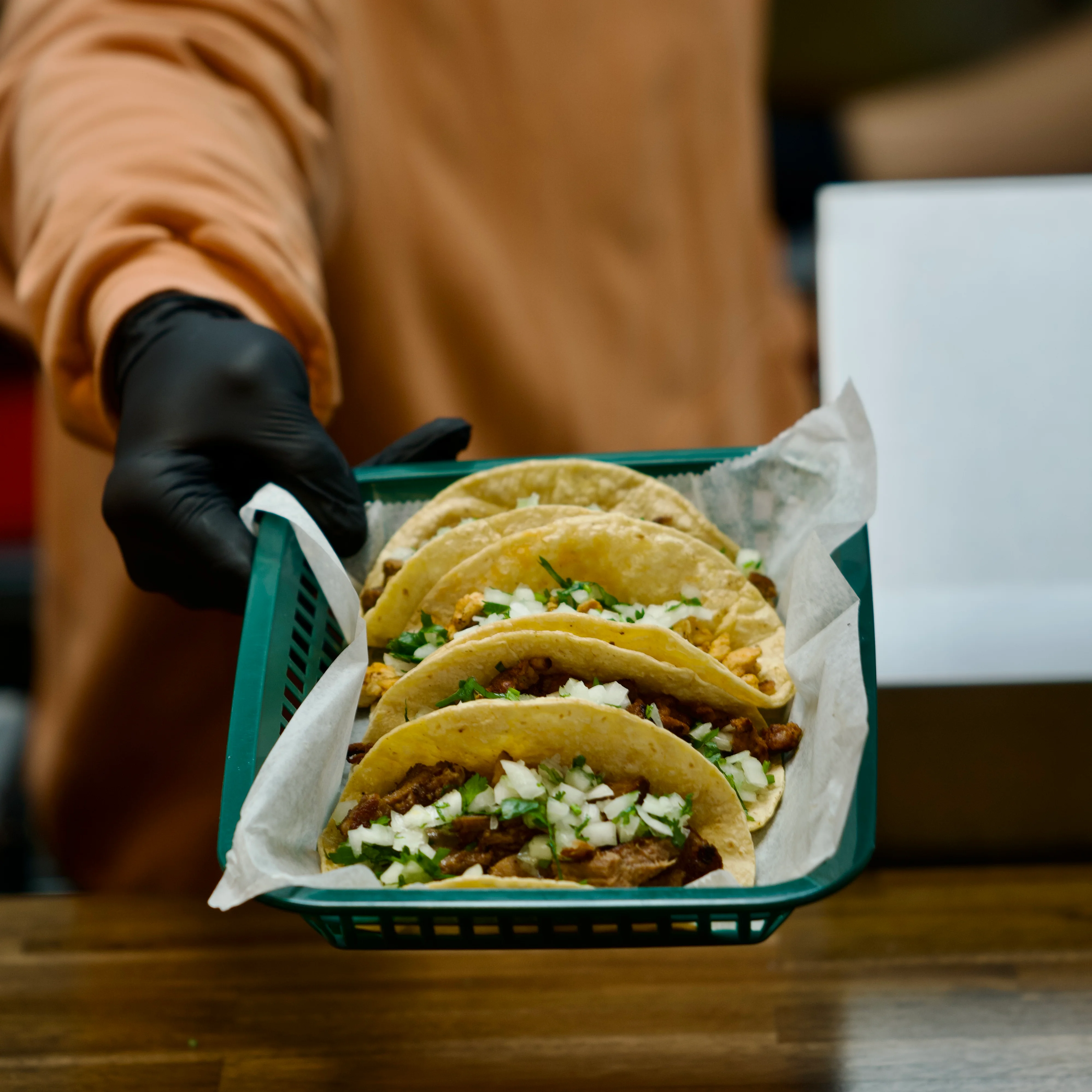 Delicious tacos with fresh ingredients on a wooden table.