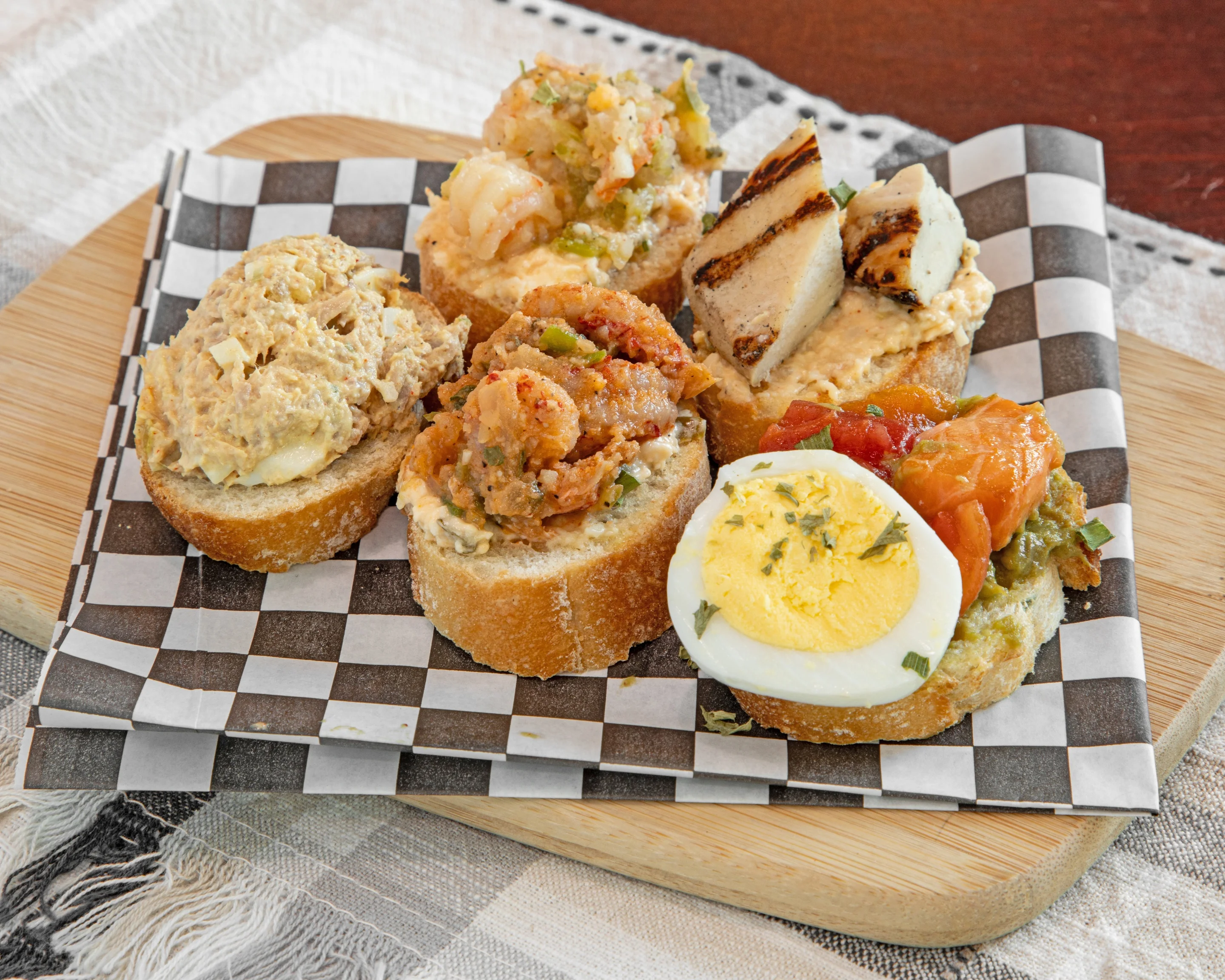 Assorted seafood crostini platter with various toppings