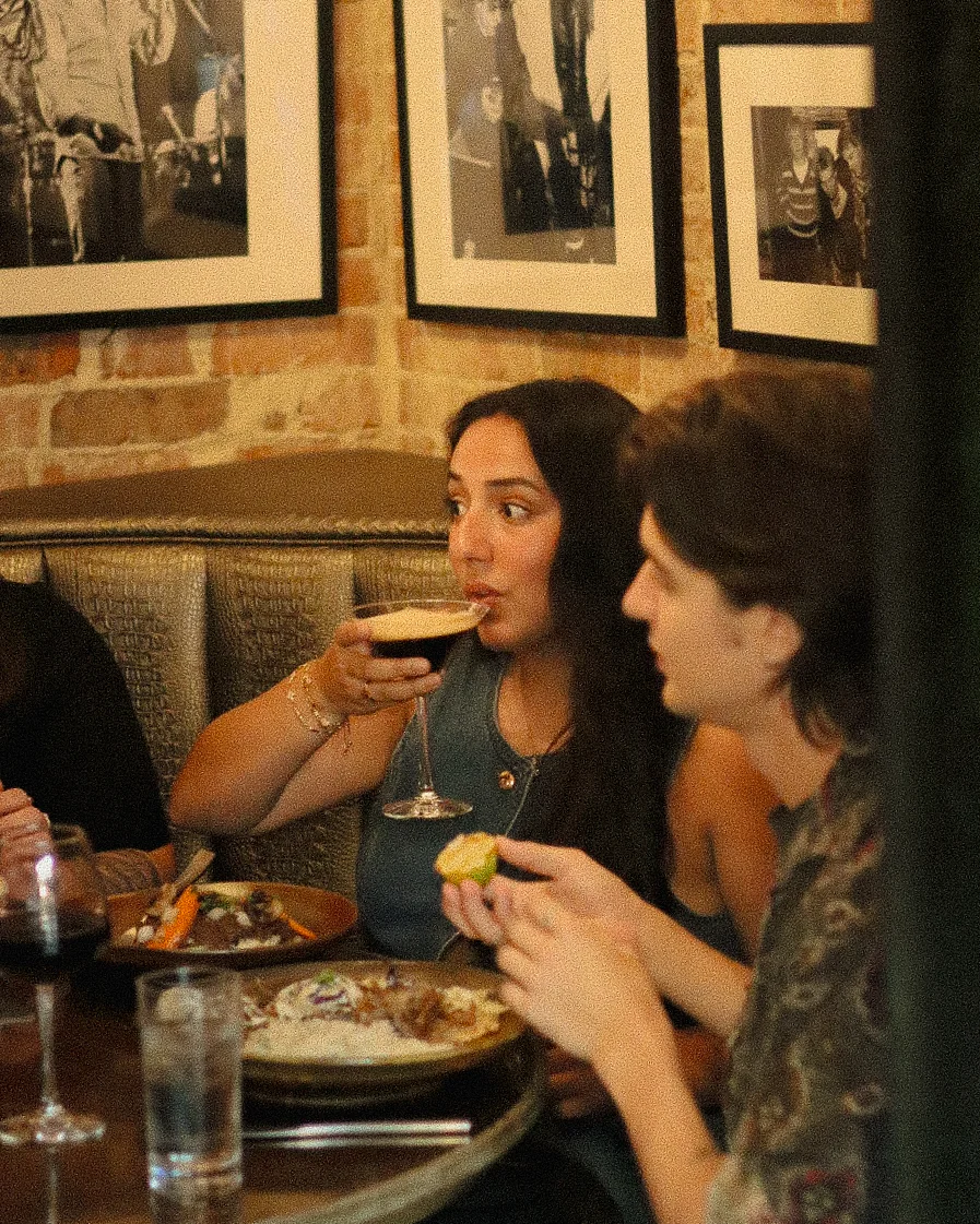 Friends drinking and eating on a night out