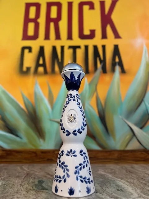 Decorative ceramic tequila bottle at Brick Cantina