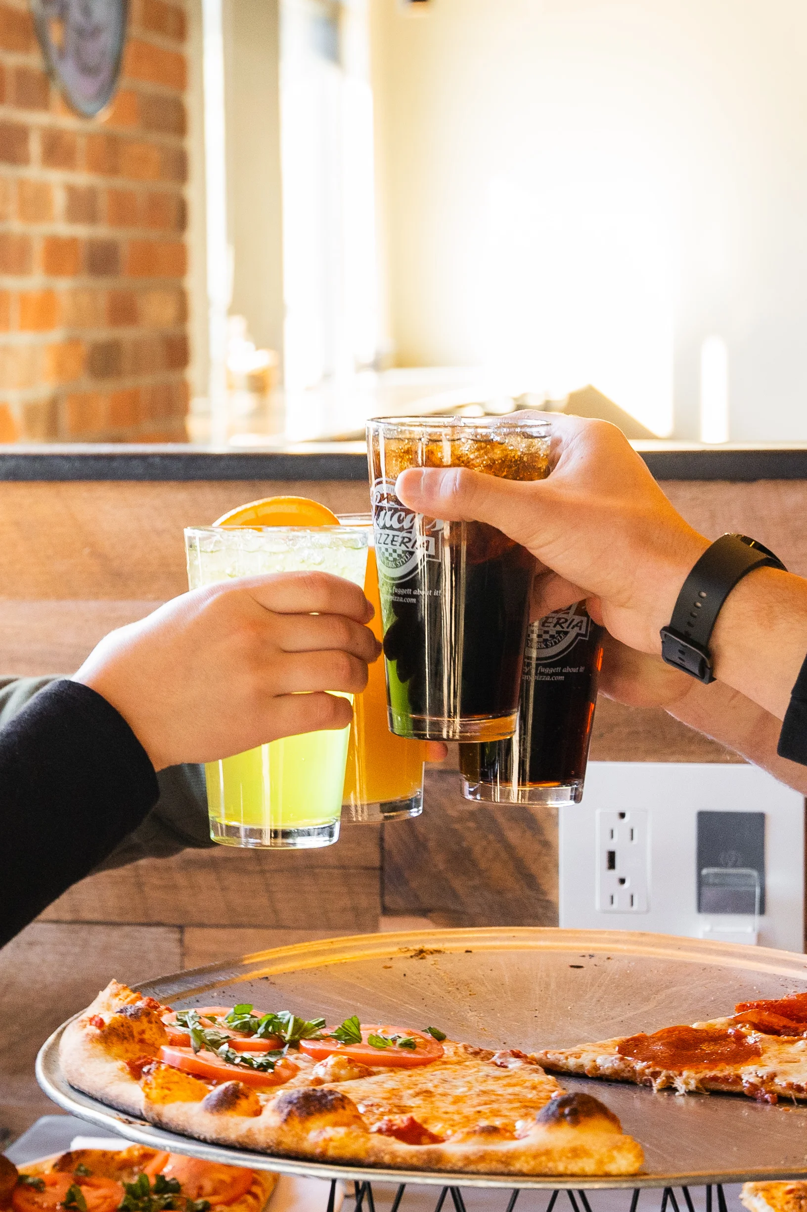 four glasses of soda