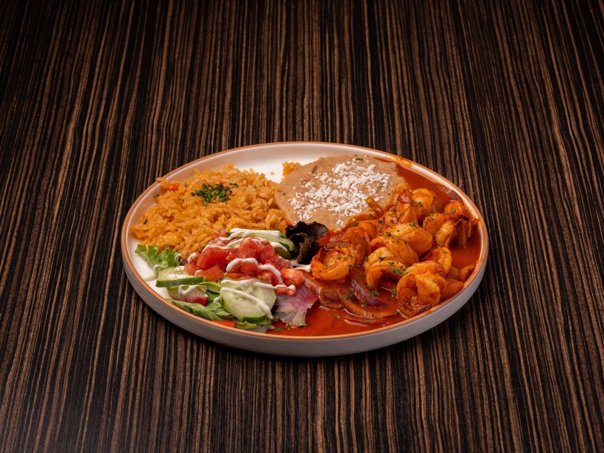 Spicy shrimp plate with rice and beans, a Mexican classic