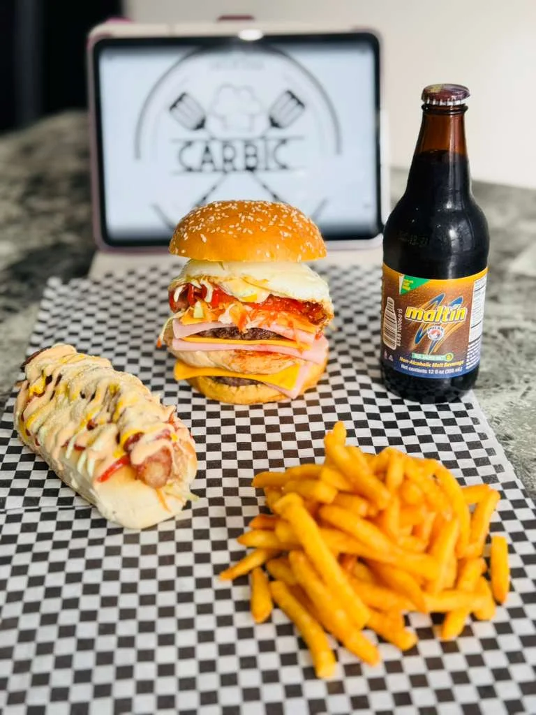 Delicious burger with fries and malt drink in a casual dining setting