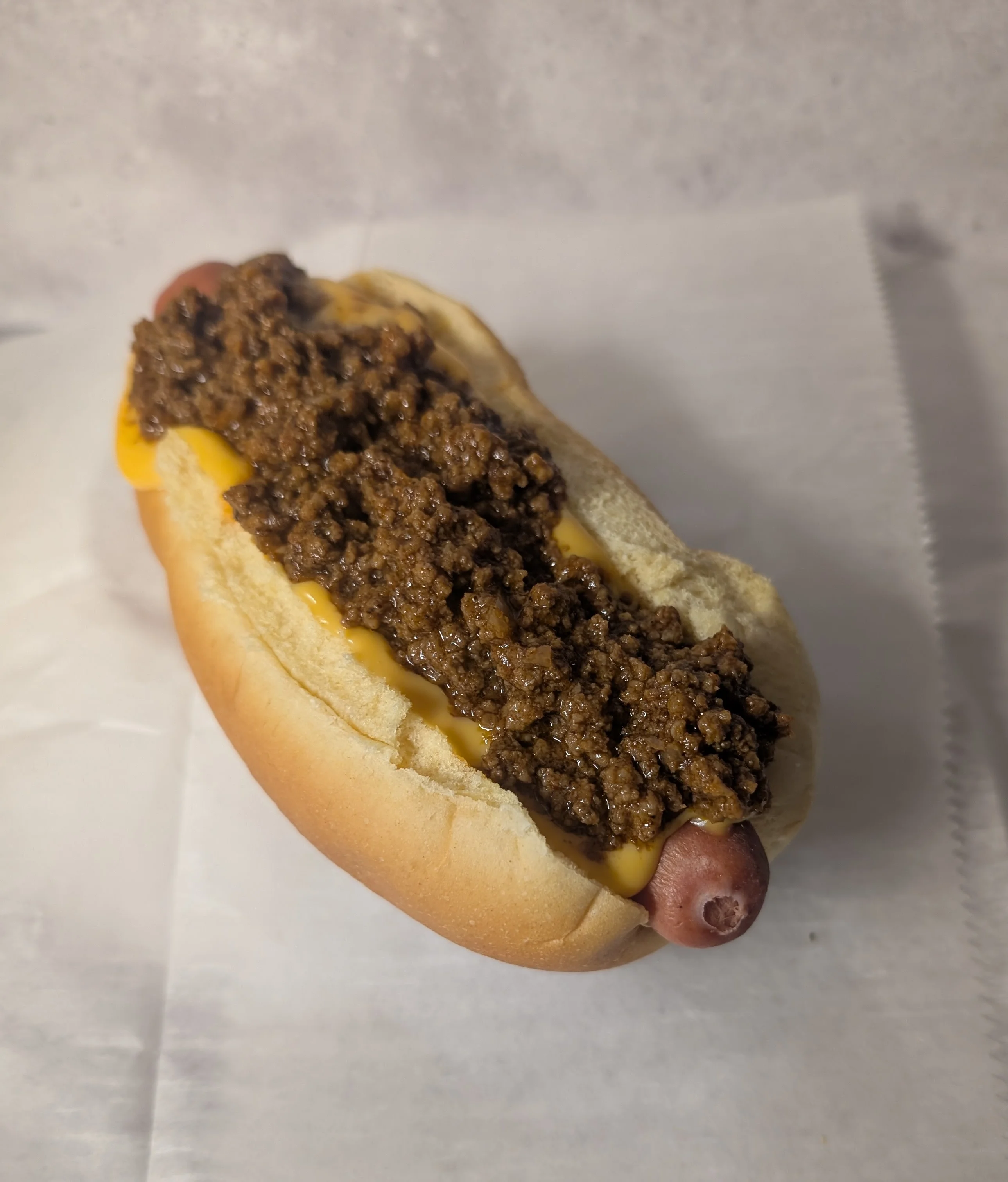 Chili cheese dog with savory beef topping