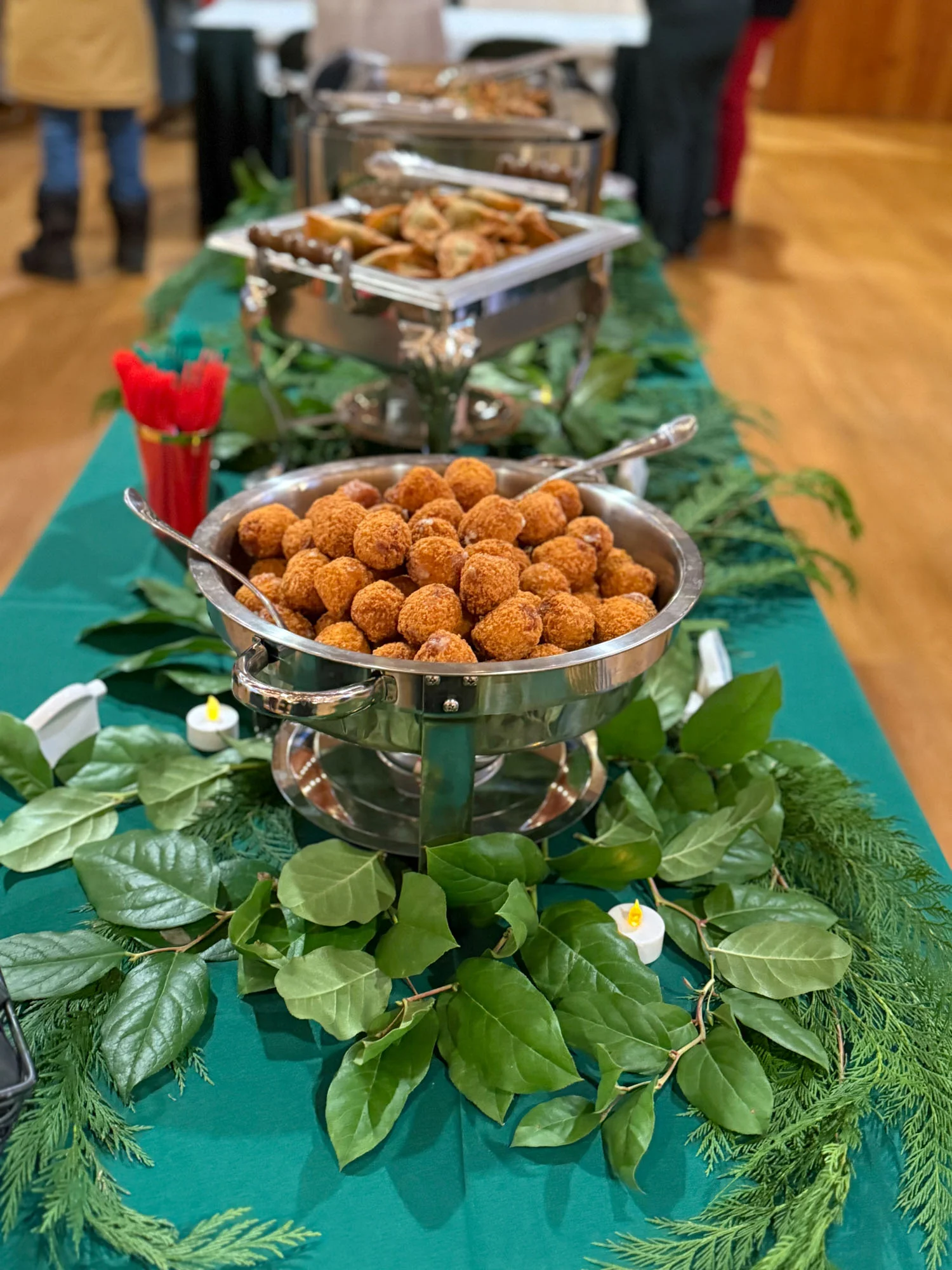 A bowl of catered food sits atop a table.
