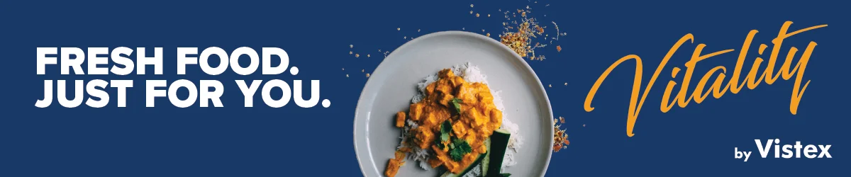 Vibrant Indian curry dish served with rice and greens