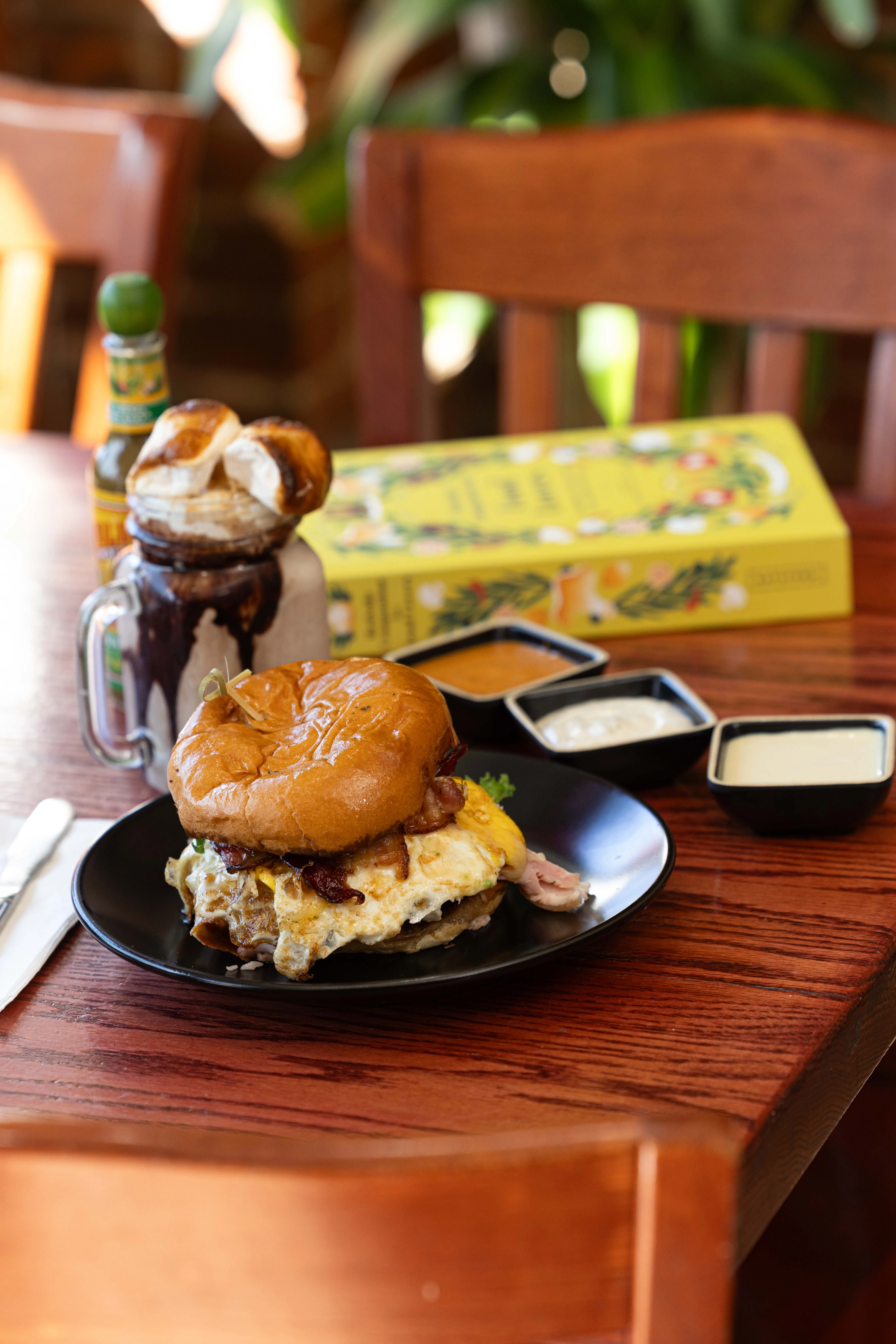 Hearty breakfast sandwich with egg and bacon on a toasted bun