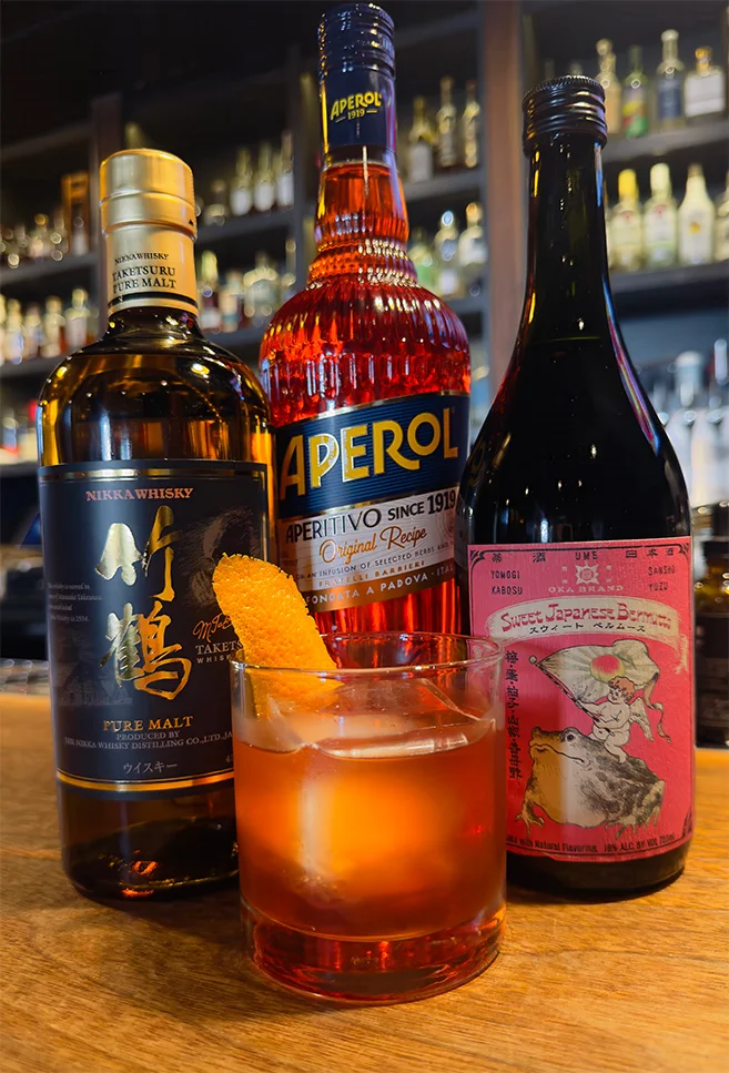 Craft cocktail featuring Japanese whisky and Aperol