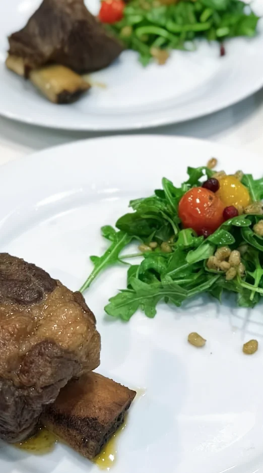 Braised beef short ribs with arugula salad