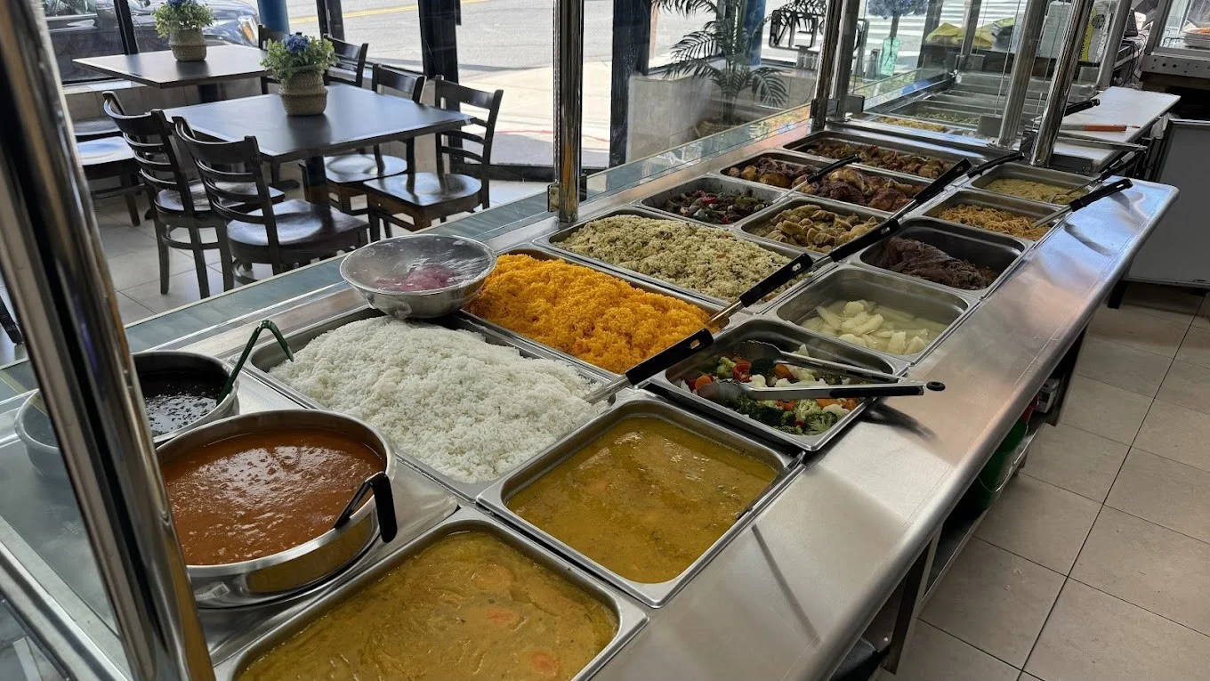 Buffet of Caribbean dishes with rice and curries