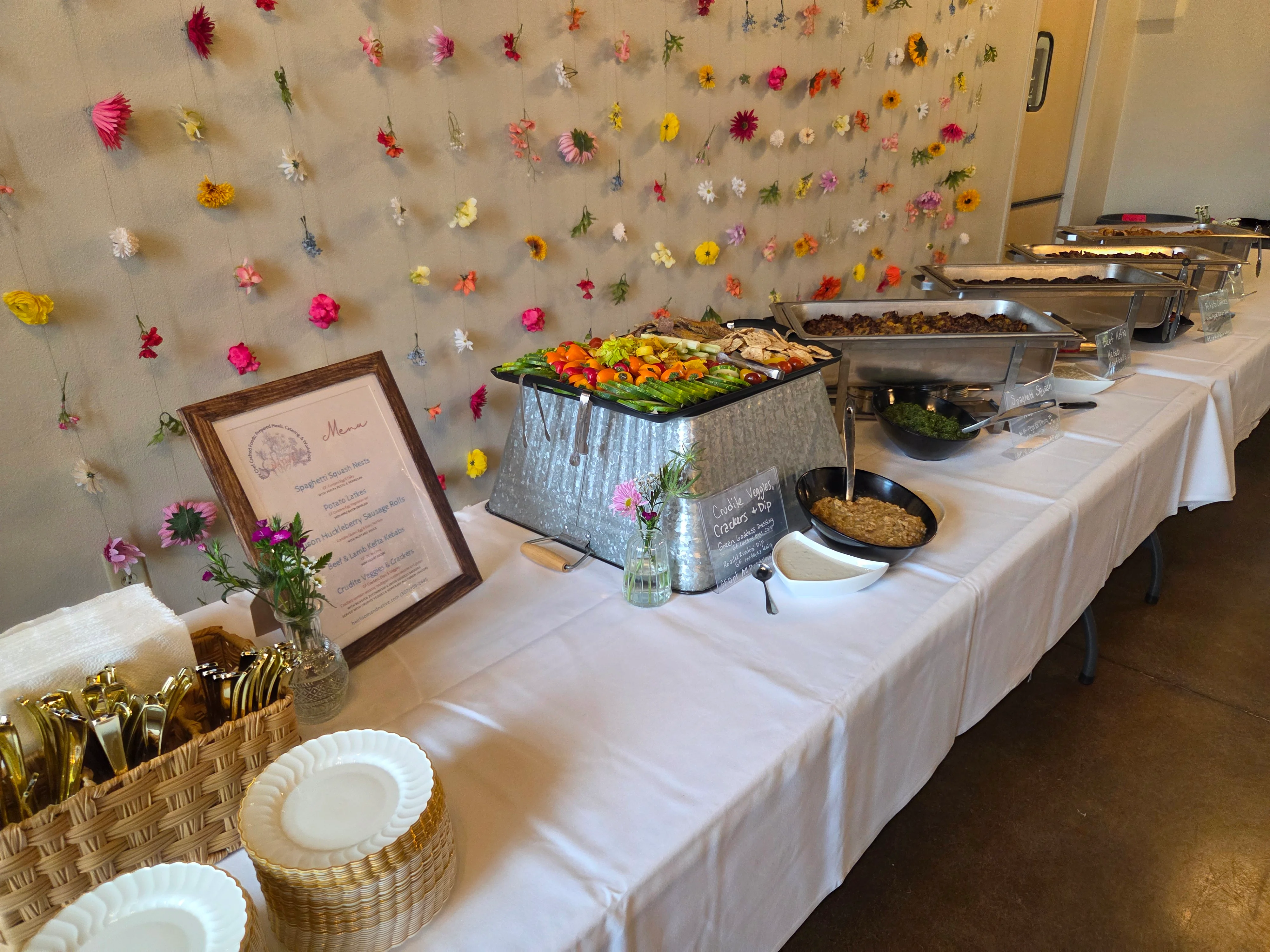 Buffet table with assorted dishes and floral decor
