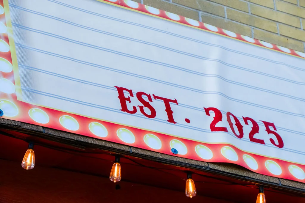 Restaurant sign indicating establishment year 2025