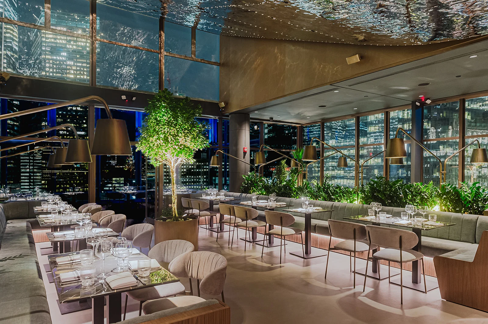 Elegant restaurant interior with city skyline views