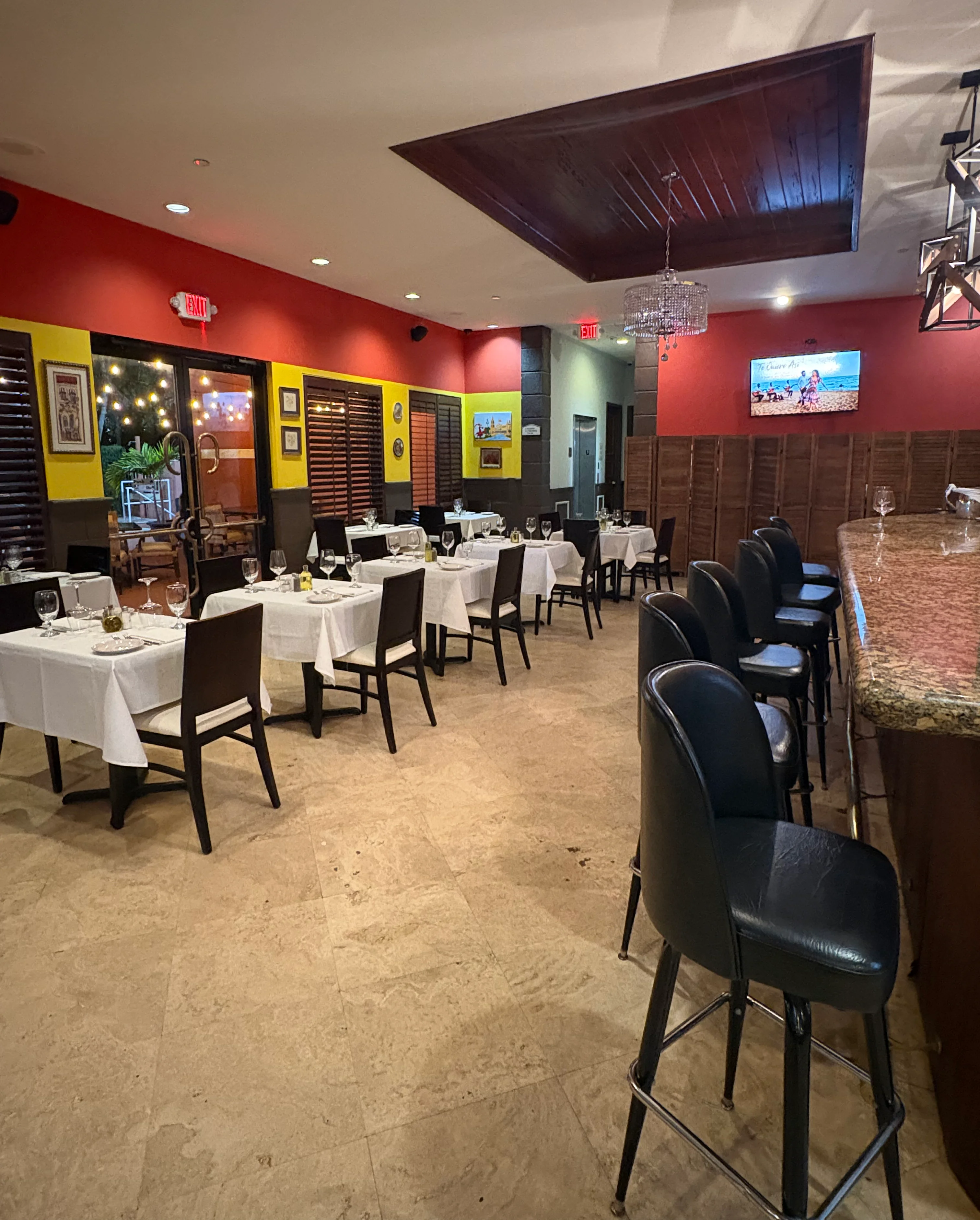 Elegant restaurant interior with white tablecloths and warm lighting