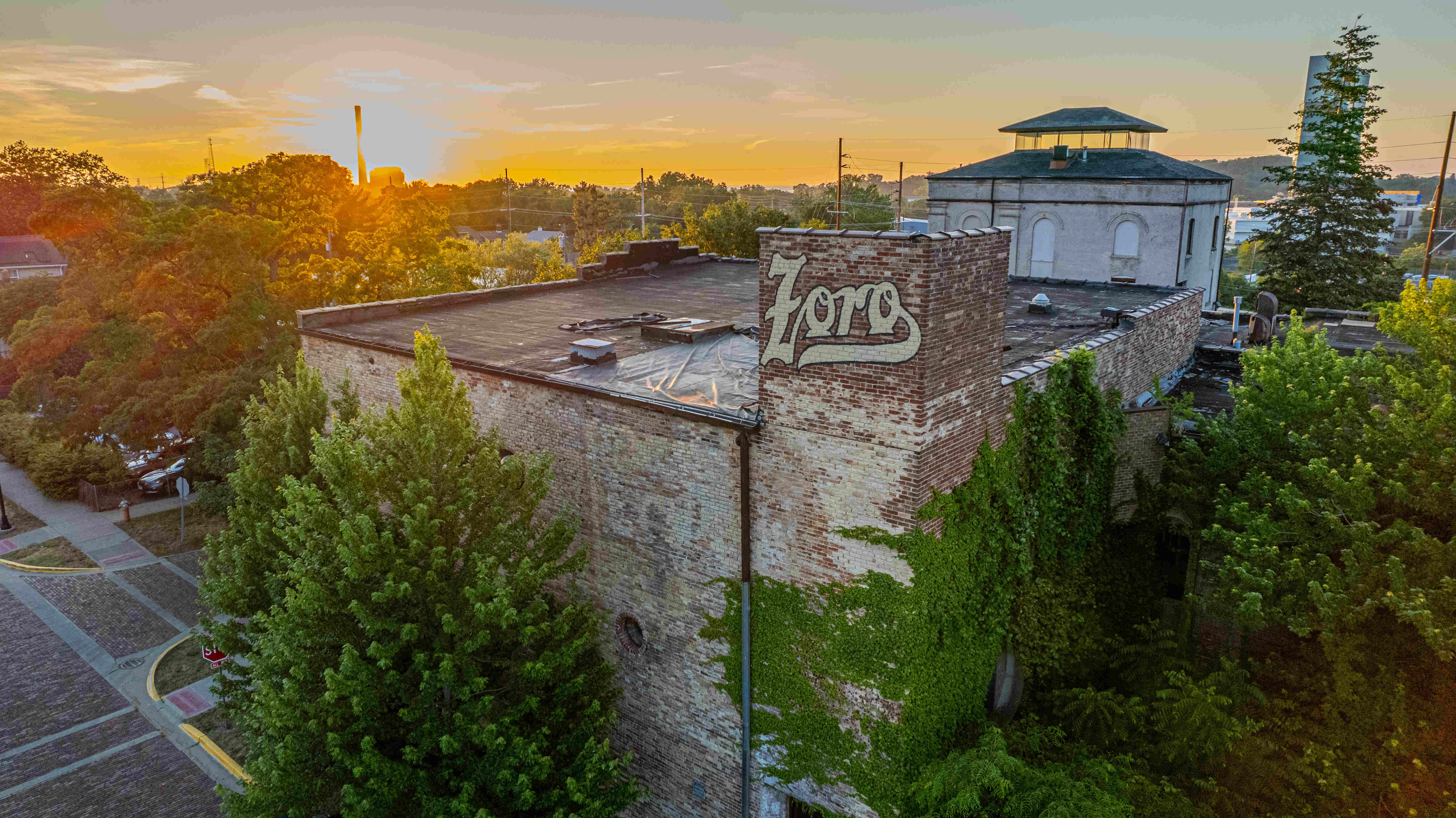 Historic building with sunset view and greenery
