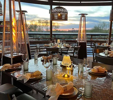 Elegant restaurant dining area with sunset view