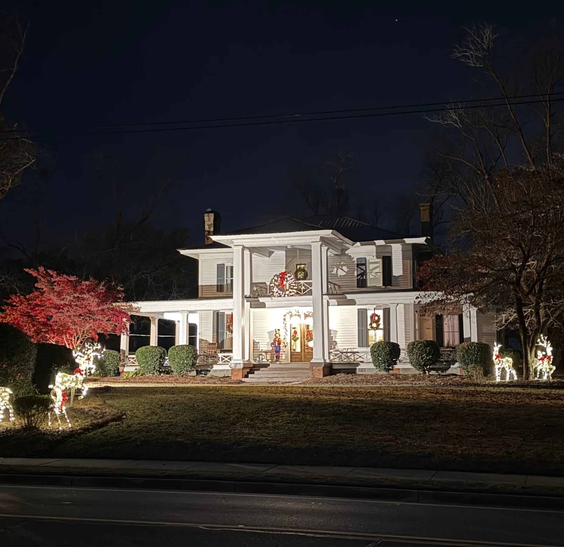Beautifully decorated house with holiday lights at night