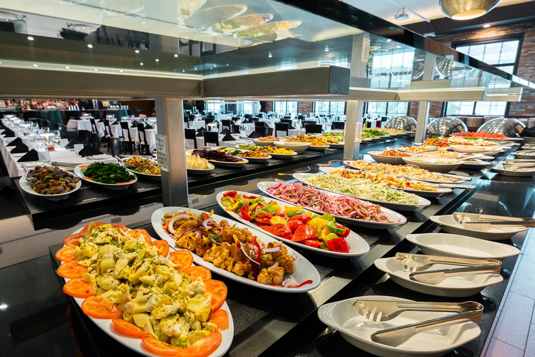 Buffet spread of Mediterranean salads and appetizers