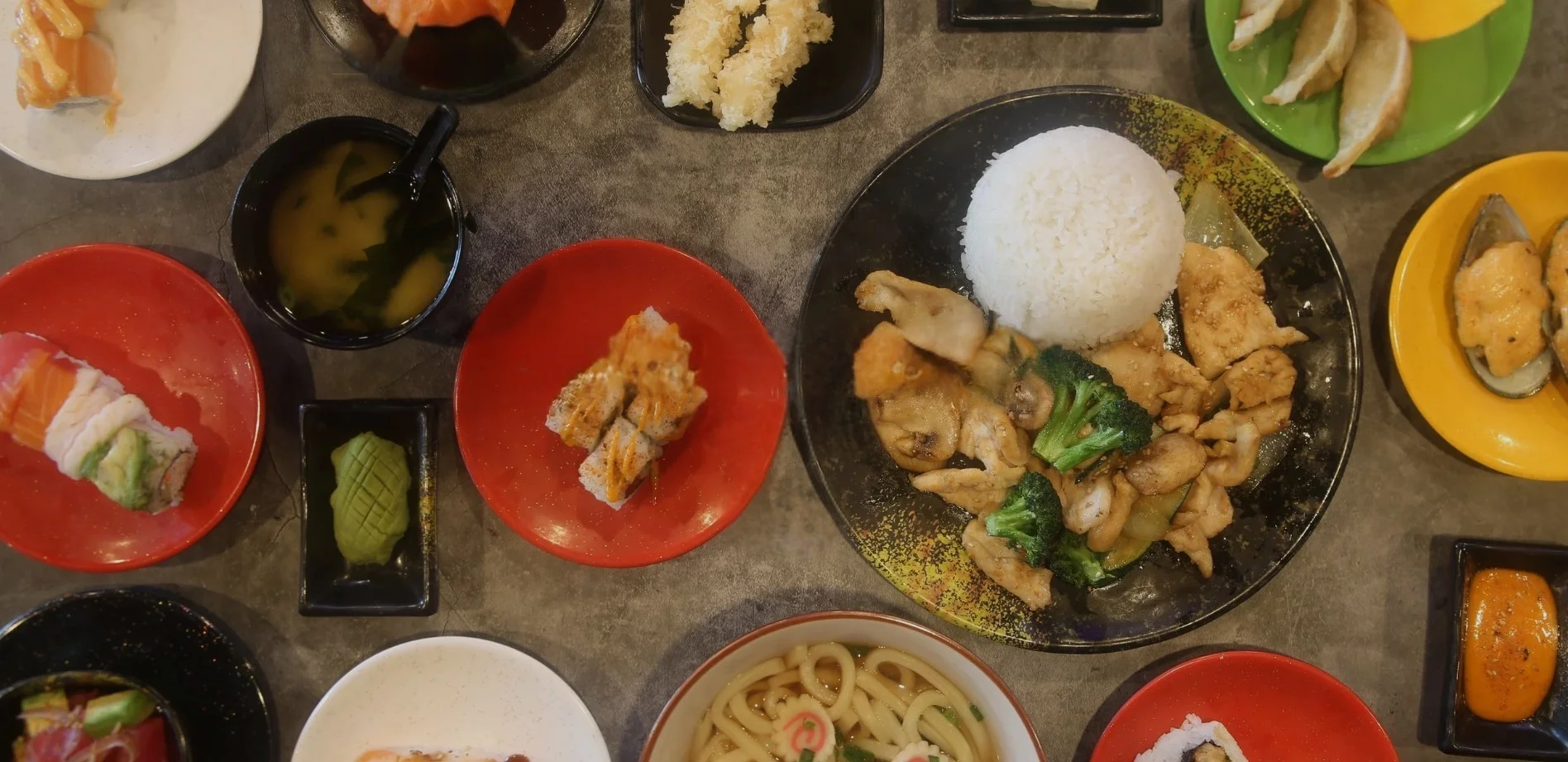 Japanese sushi platter with miso soup and chicken rice bowl