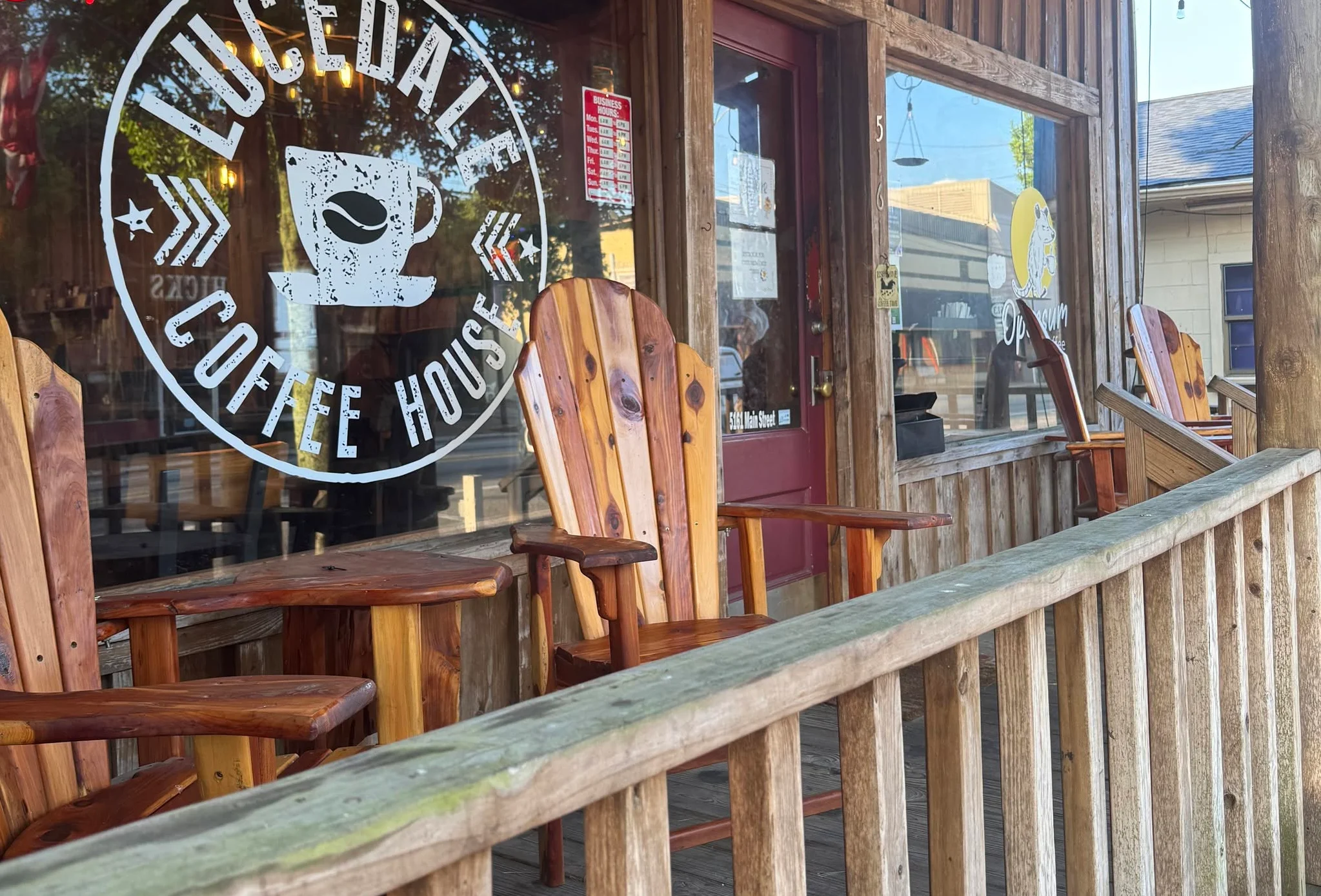 Charming coffee house exterior with wooden seating and welcoming signage