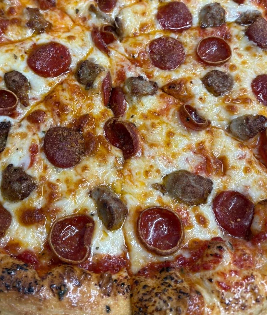 Delicious brisket pizza topped with fresh ingredients.