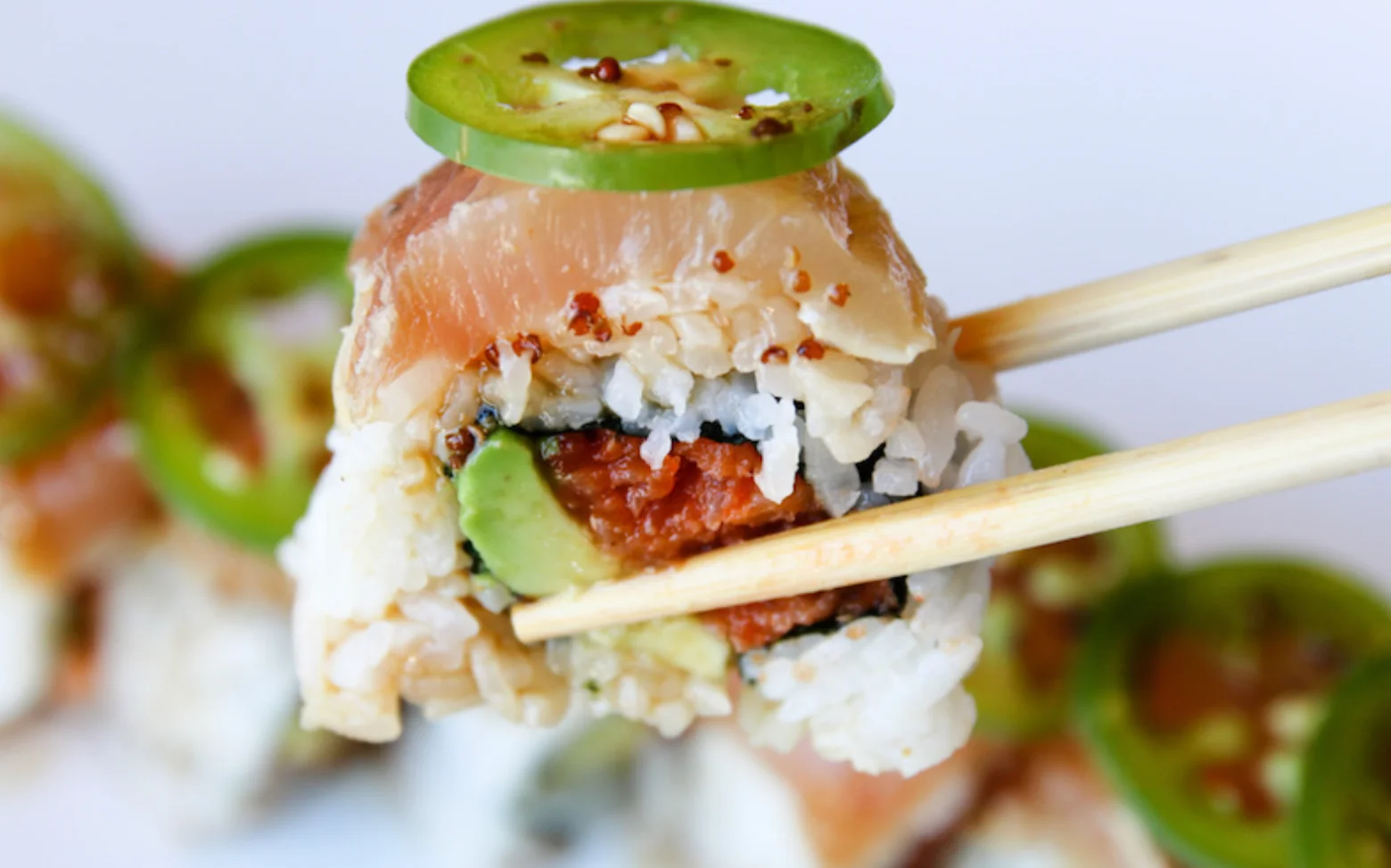 Sushi roll topped with jalapeño slices