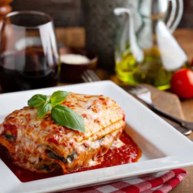 Classic Italian lasagna served with marinara sauce