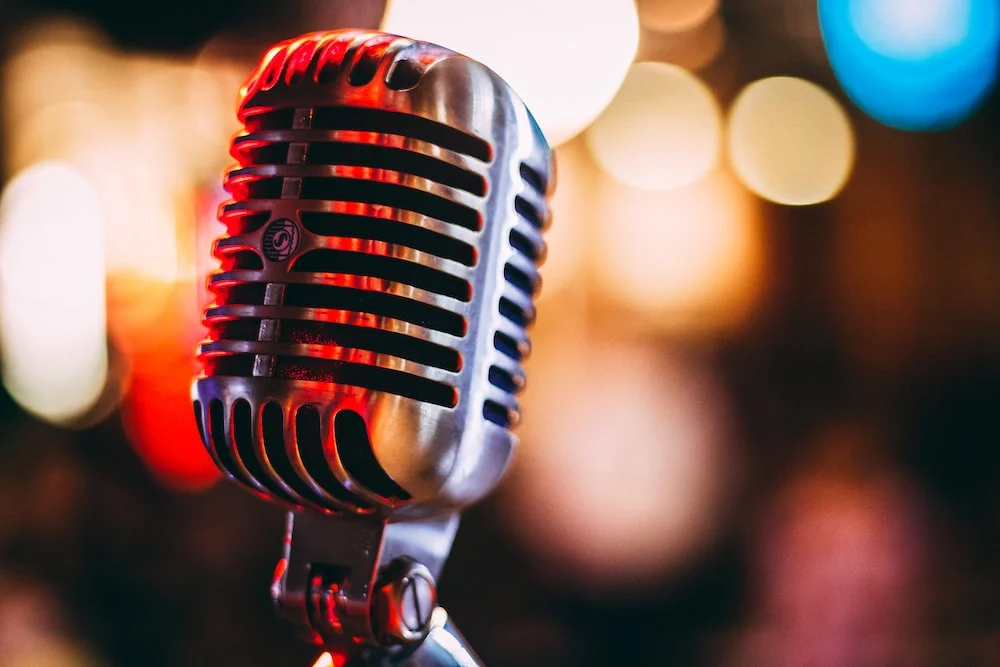 Vintage microphone with blurred background lights