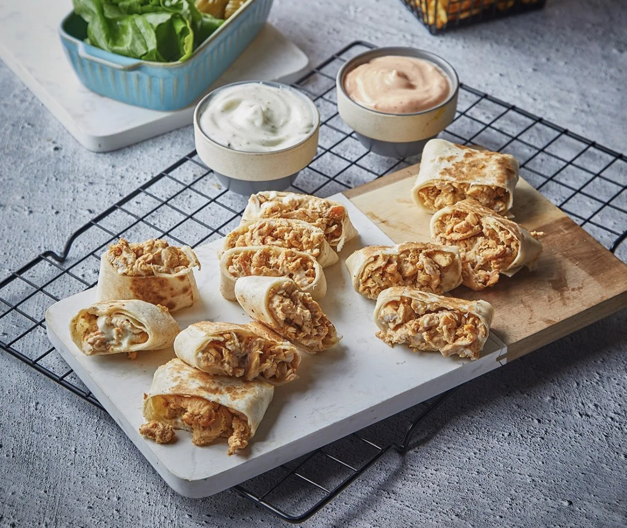 Crispy chicken wraps served with dipping sauces