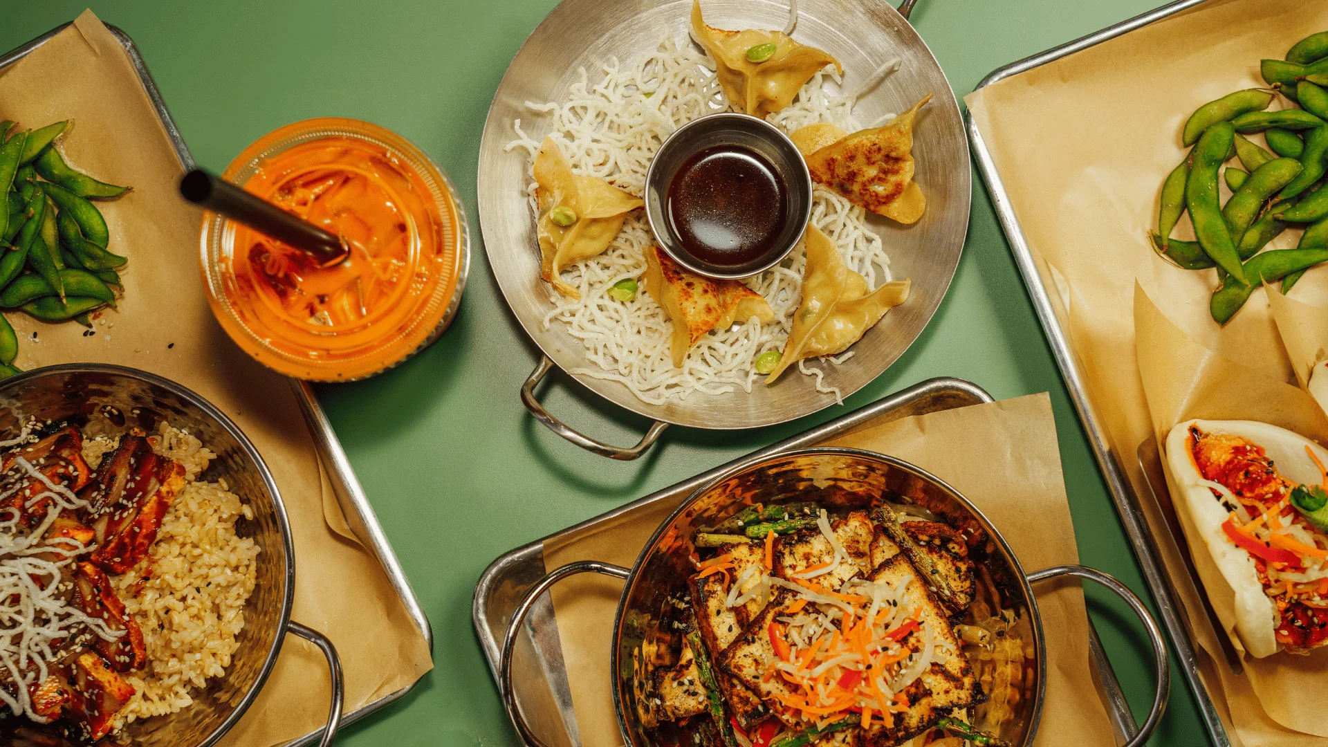Assorted Asian fusion dishes with dumplings and rice