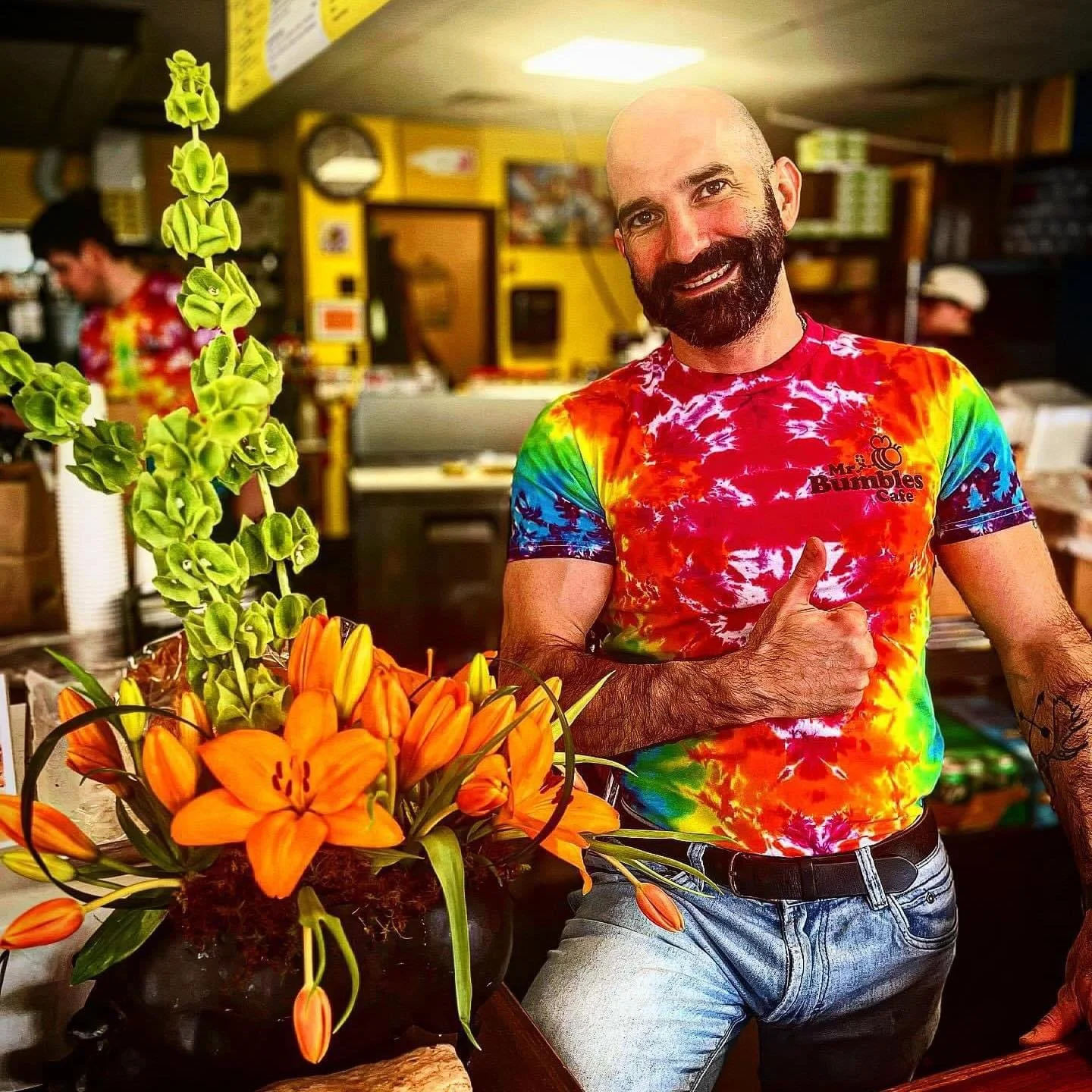 Vibrant cafe interior with colorful decor and flowers