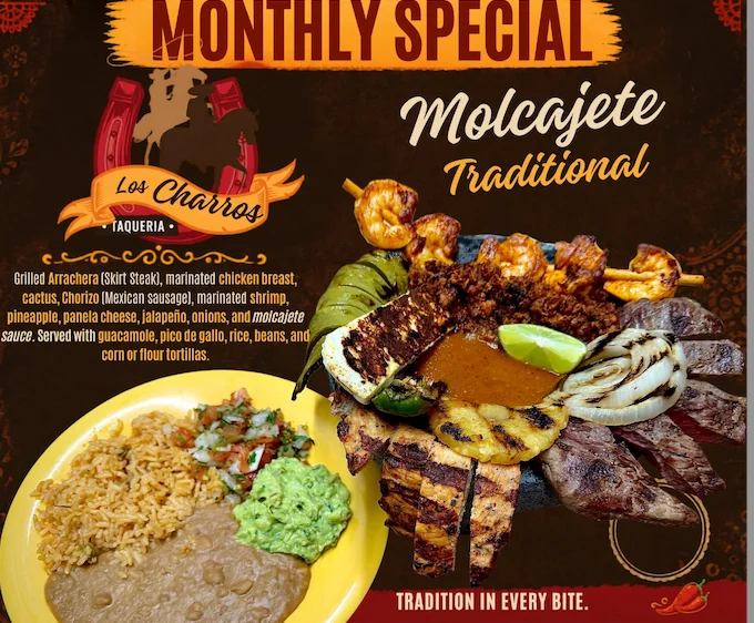 A vibrant molcajete dish with various meats and vegetables served in a stone bowl.