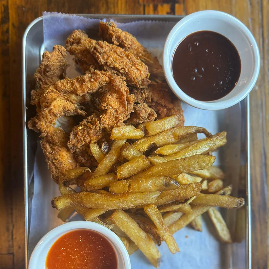 Southern fried chicken with fries and dipping sauces