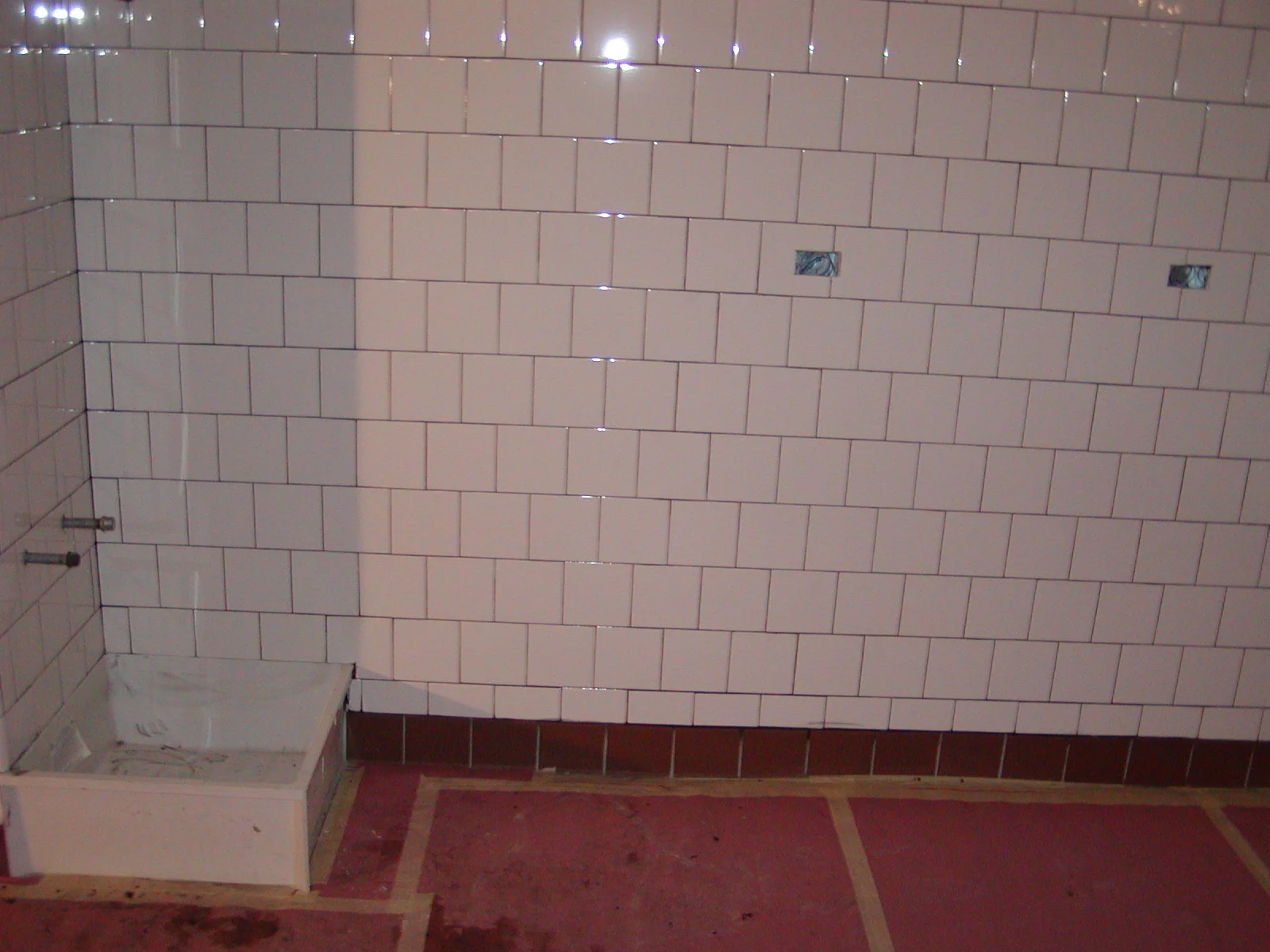 Tiled wall in a restaurant kitchen under construction