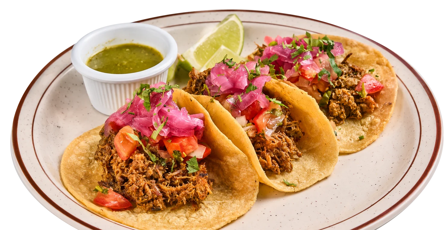 Authentic Mexican tacos with shredded meat, pickled red onions, cilantro and salsa at Catrina Querida in Doral