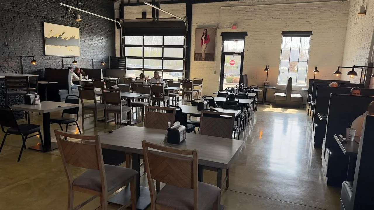 Cozy restaurant interior with modern decor and ample seating