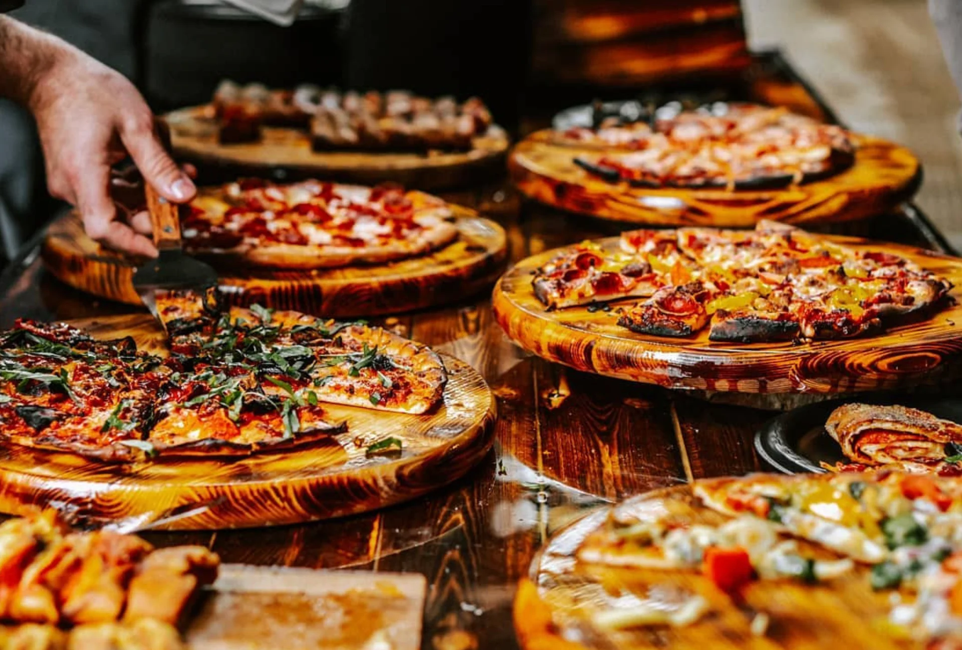 A top view of a classic pepperoni pizza with a golden crust and numerous slices of pepperoni on a cheese base.