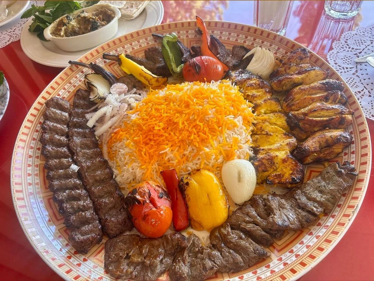 Persian kebab platter with saffron rice and grilled vegetables