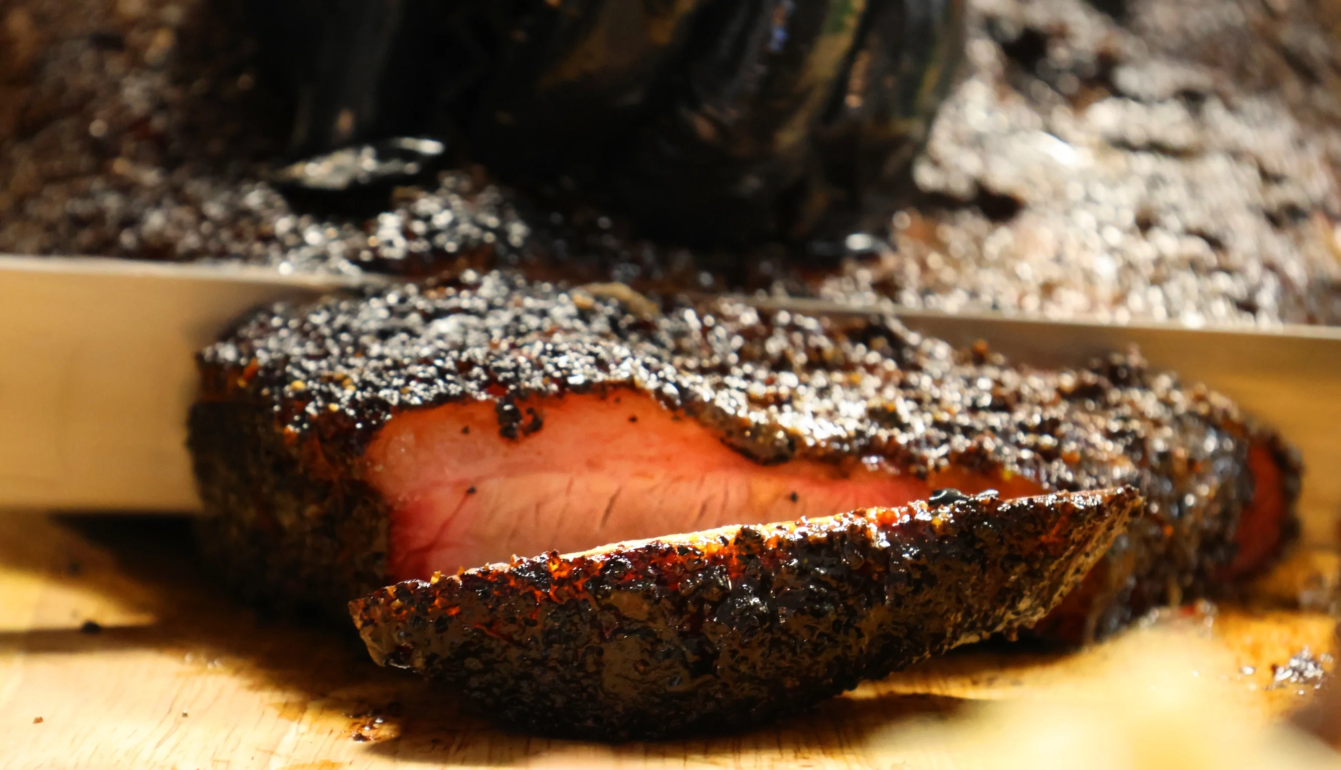 Smoked brisket with a flavorful crust, sliced and ready to serve