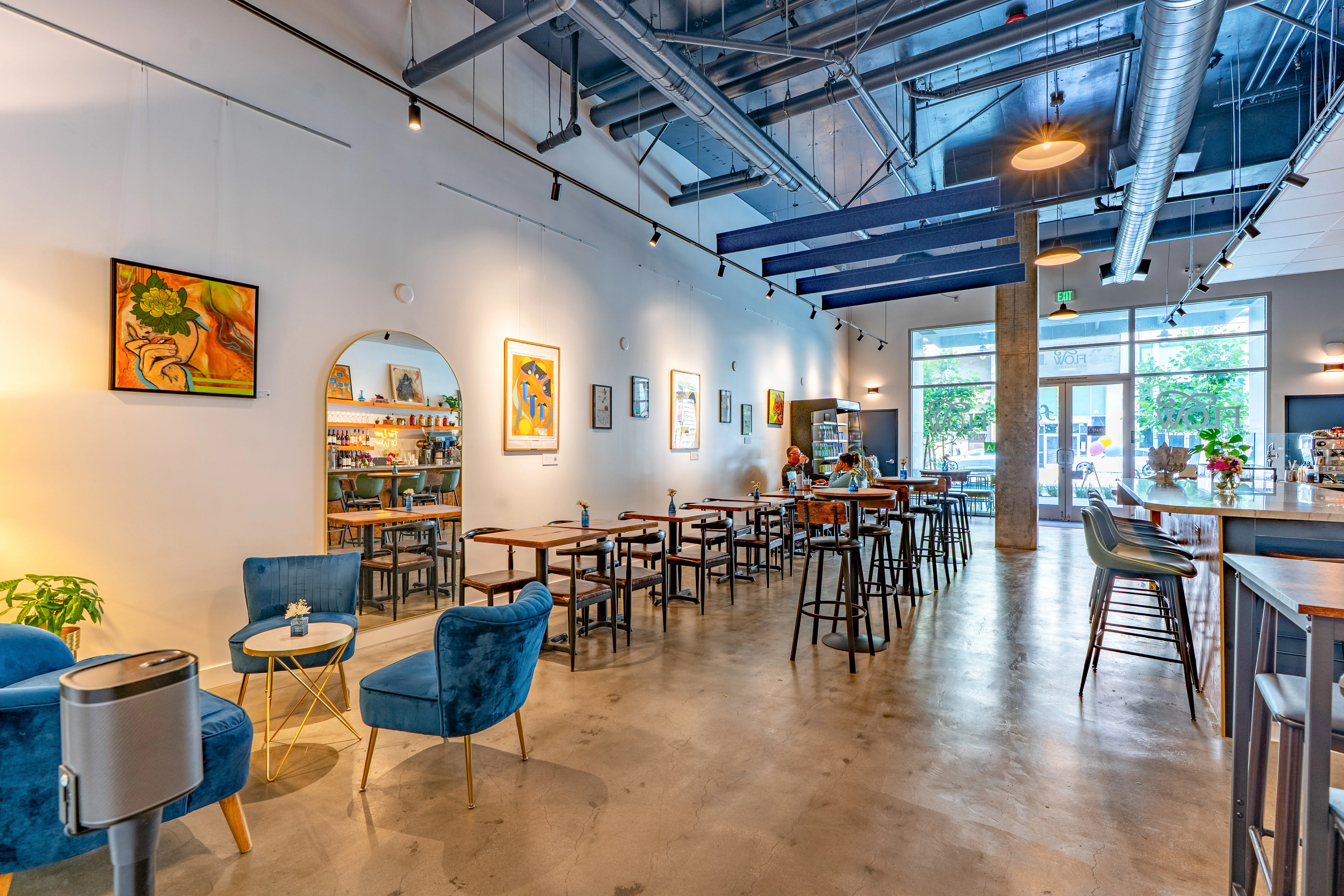 Modern restaurant interior with artistic decor and cozy seating