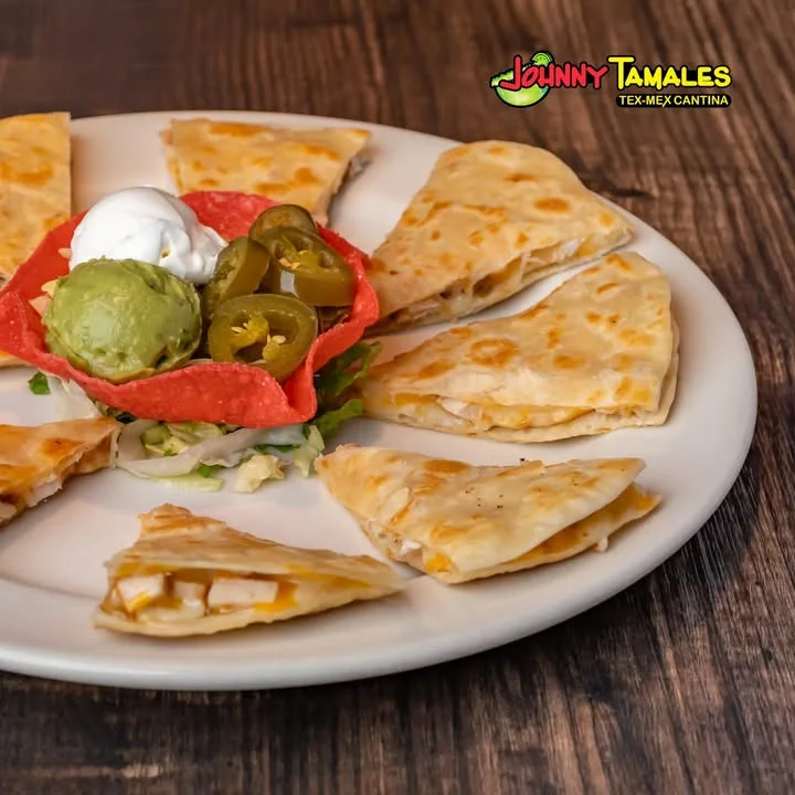 Tex-Mex quesadillas served with guacamole and jalapeños