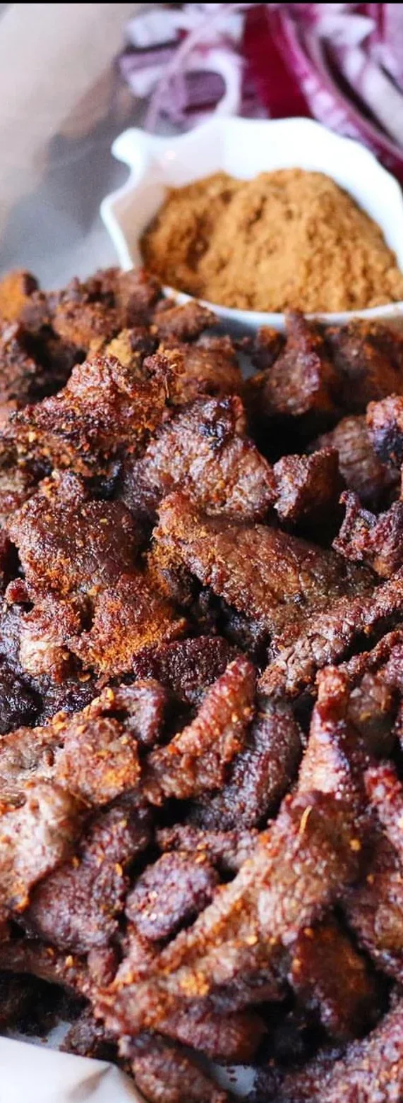 Nigerian suya skewers served with fresh vegetables