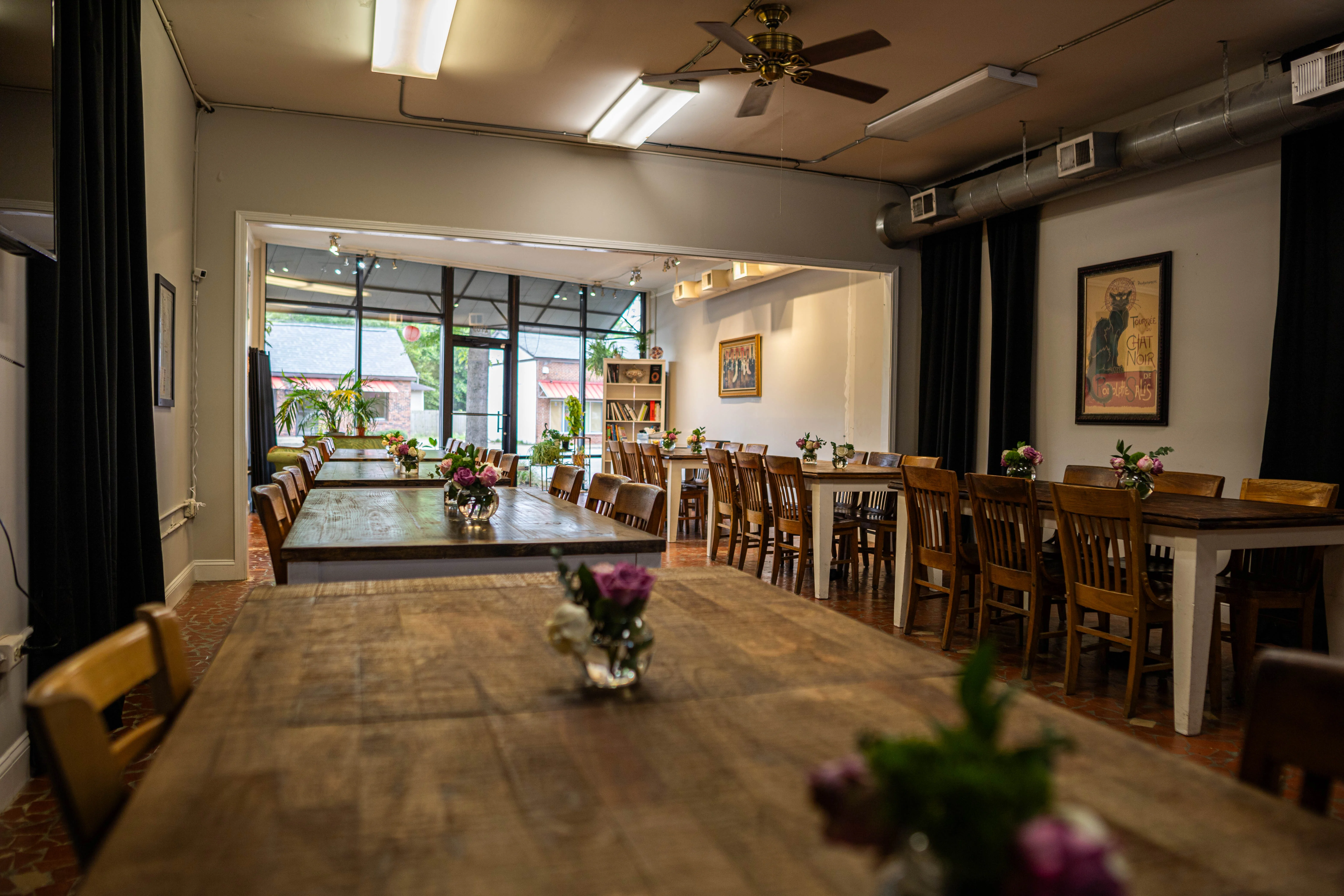 Cozy restaurant interior with wooden tables and floral centerpieces