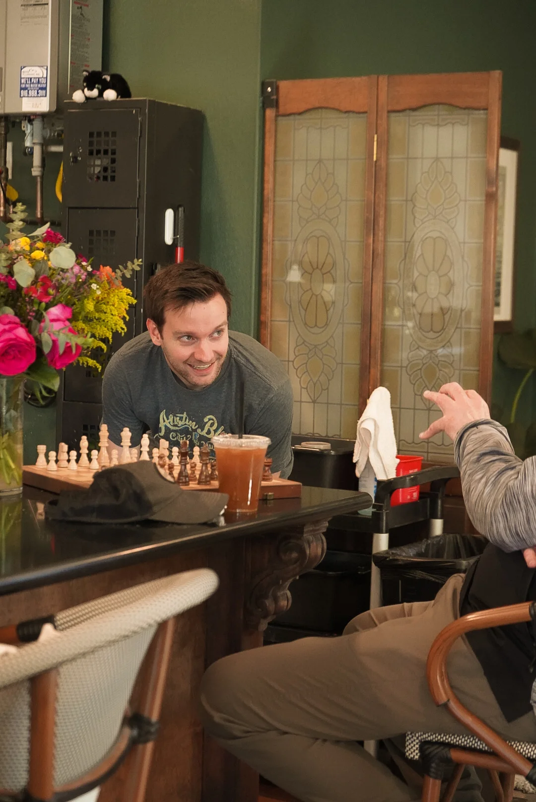 Cozy café interior with chess and friendly conversation