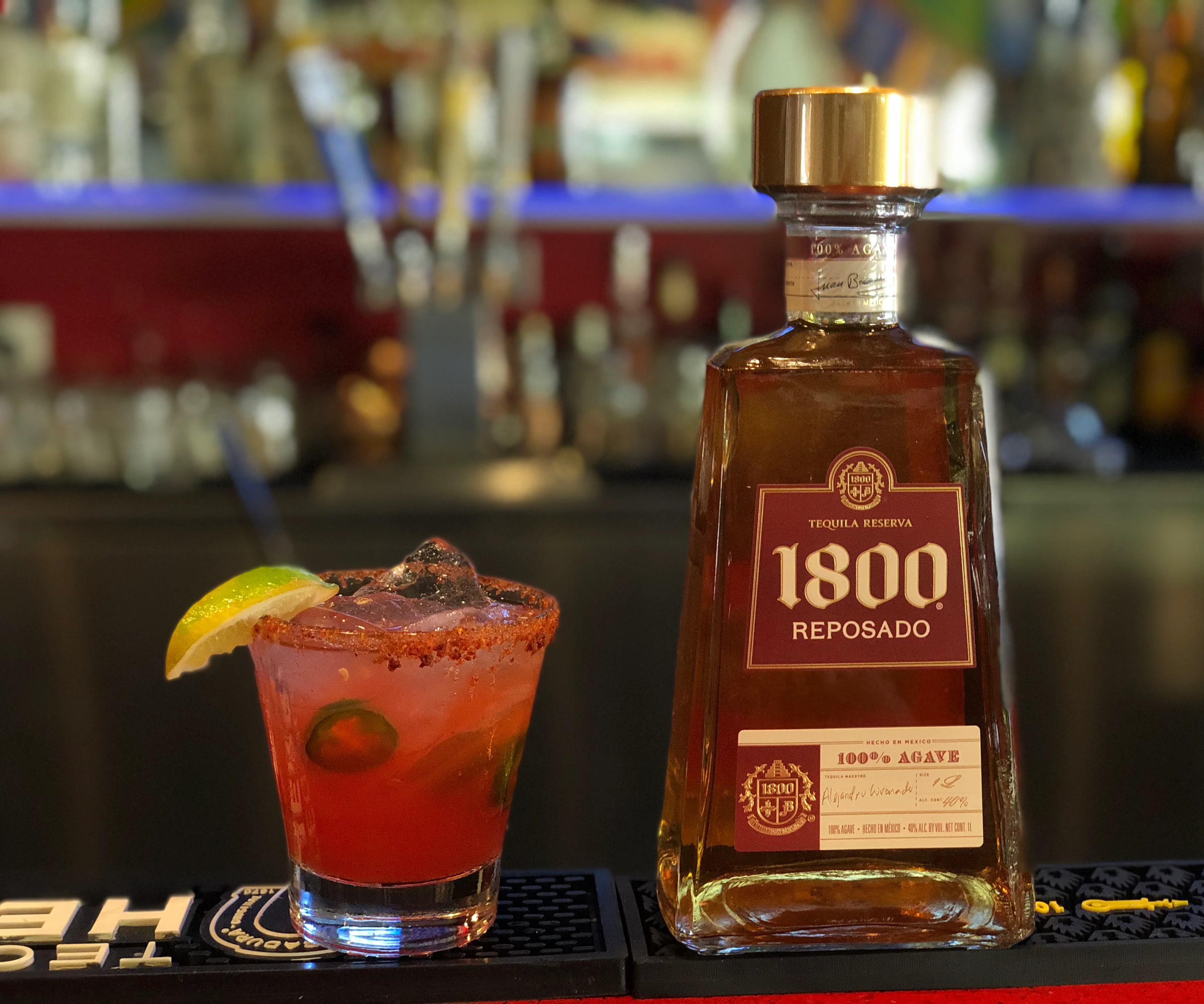 Refreshing cocktail with tequila and lime at a vibrant bar