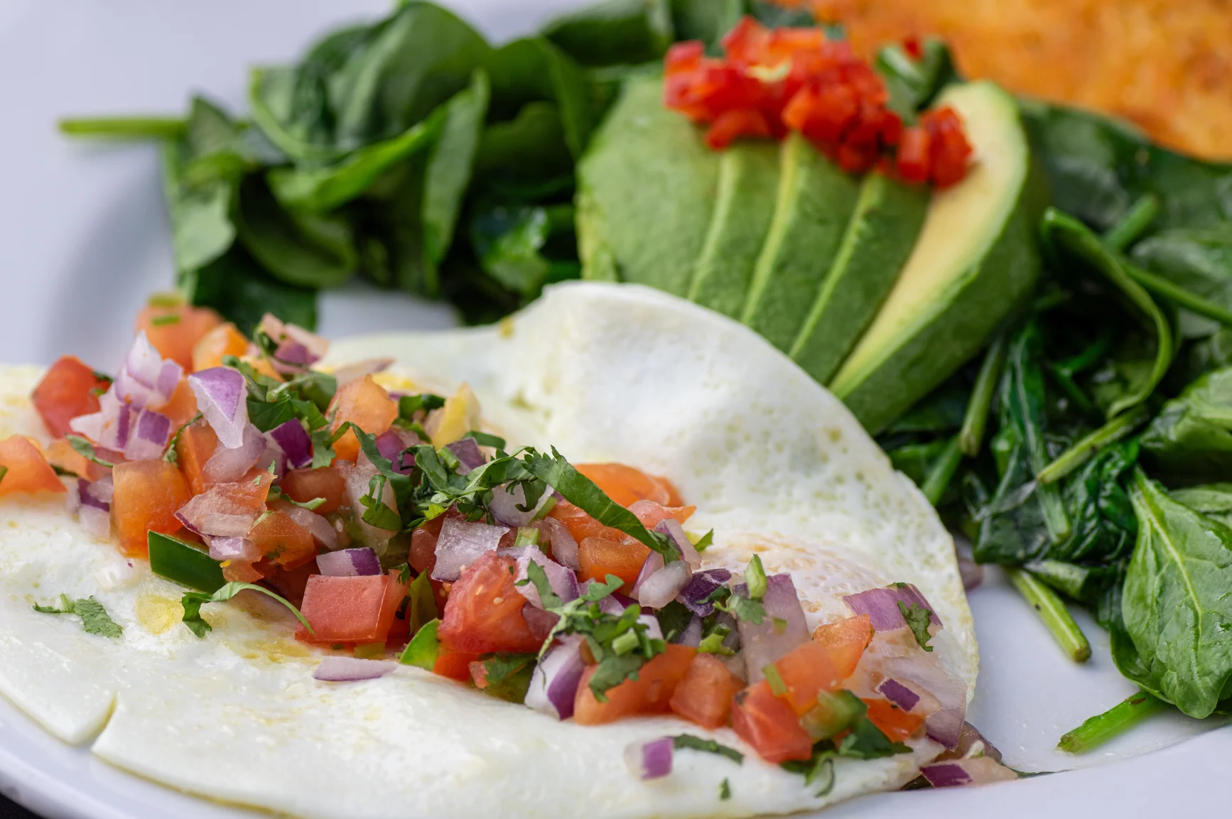 A healthy vegetarian taco filled with pico de gallo