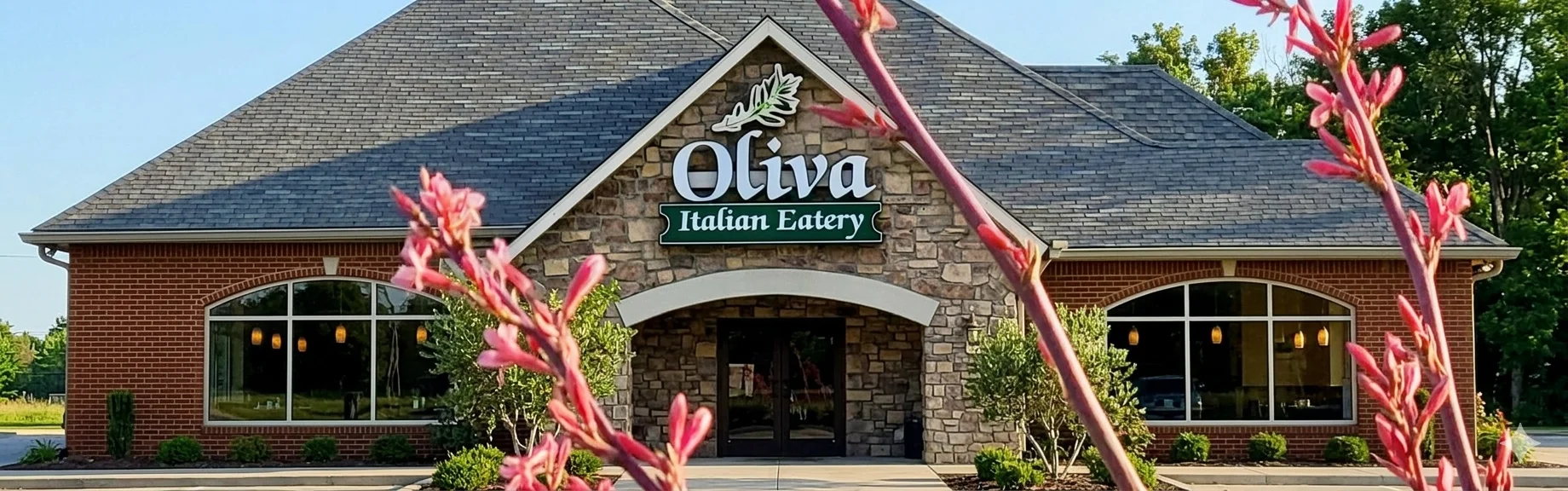 Charming Italian eatery exterior with stone facade and greenery